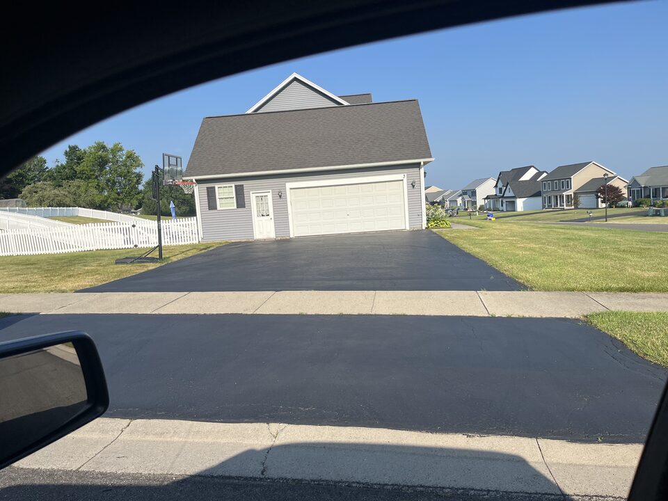 Freshly sealed residential driveway in Brighton, NY